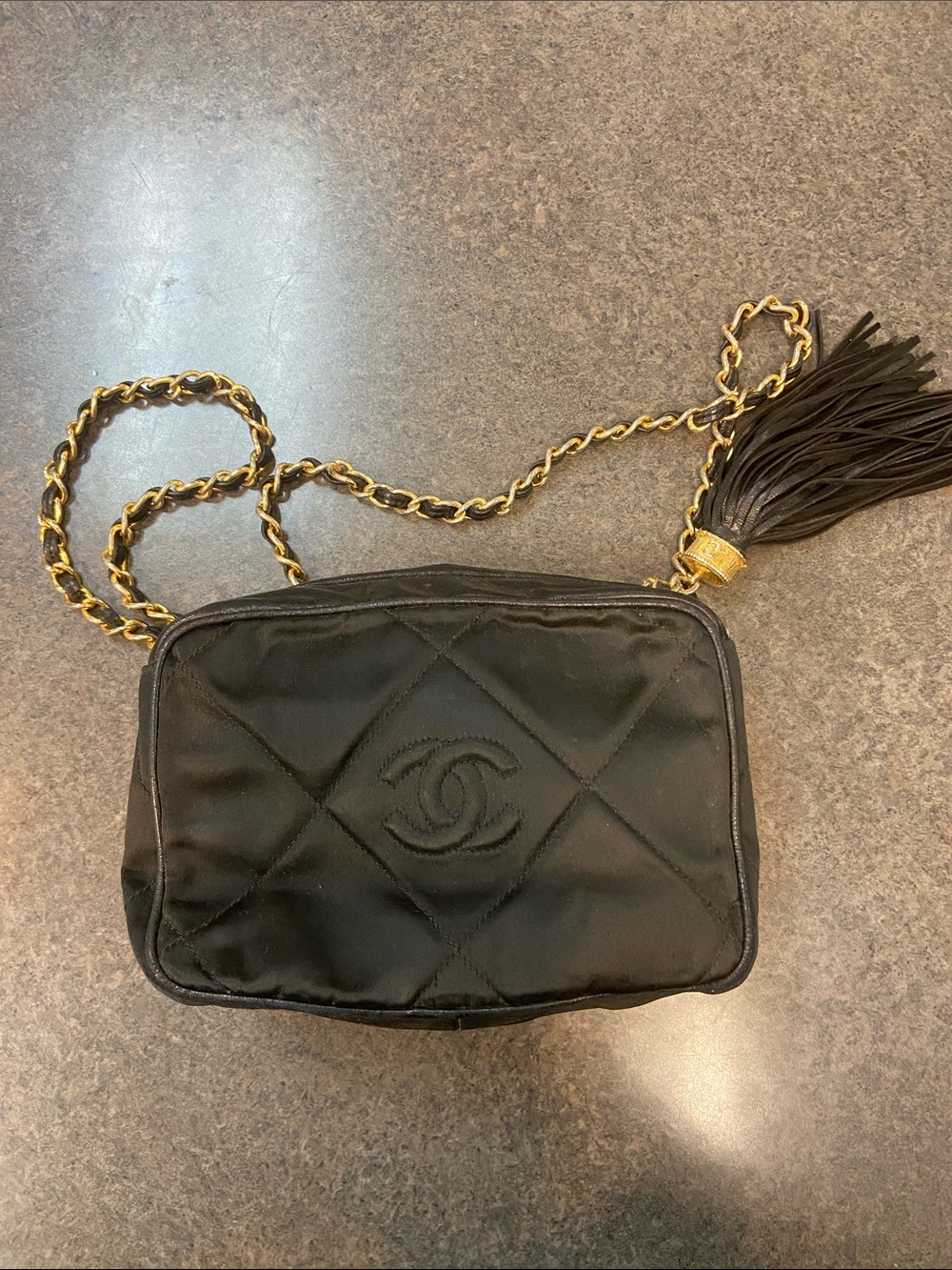 CHANEL Black Quilted Crossbody Bag with Gold Chain and Tassel